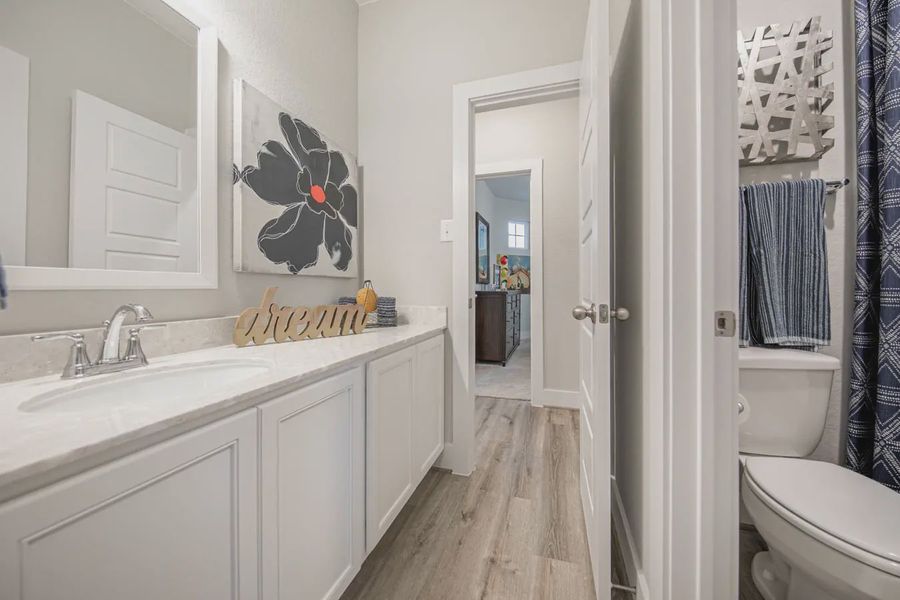 Representative furnished interior of a home built from the Asher by Chesmar Homes in Buffalo Crossing, Cibolo (Image 22).
