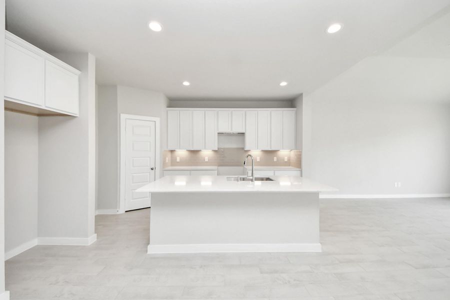 This kitchen is by far any chef’s dream! This spacious kitchen features high ceilings, light stained wood cabinets, granite countertop, SS appliances, modern tile backsplash, recessed lighting, extended counter space, granite kitchen island with double sink, and space for breakfast bar, and a walk-in pantry all overlooking your huge family room. This kitchen is by far any chef’s dream! This spacious kitchen features high ceilings, light stained wood cabinets, granite countertop, SS appliances, modern tile backsplash, recessed lighting, extended counter space, granite kitchen island with double sink, and space for breakfast bar, and a walk-in pantry all overlooking your huge family room.