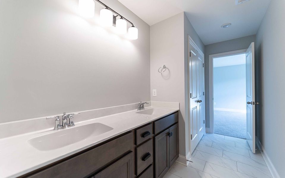 Furnished interior view inside a new home in Aden Woods, Fairview (Image 10).