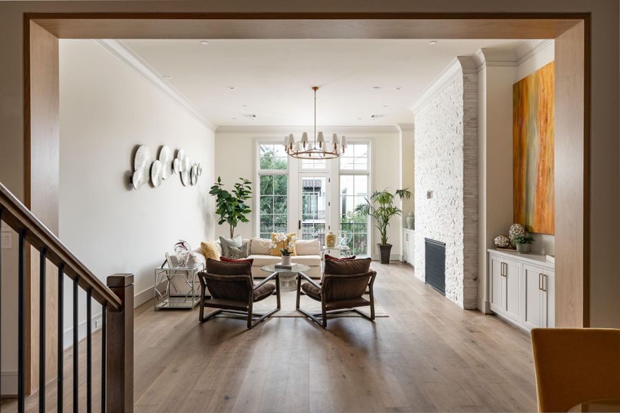 The white oak-wrapped casement creates a dramatic division between the dining room and family room on the second floor. Large open rooms and high ceilings give this home a feeling that is both decadent and welcoming at the same time. The white oak-wrapped casement creates a dramatic division between the dining room and family room on the second floor. Large open rooms and high ceilings give this home a feeling that is both decadent and welcoming at the same time.