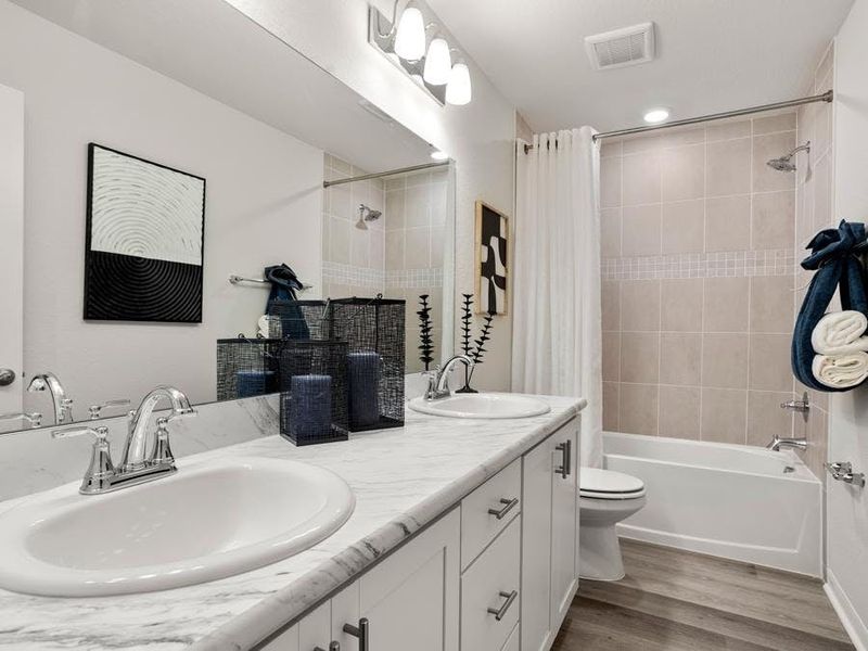 Secondary bedrooms share a dual vanity upstairs bath - Catalina townhome by Highland Homes Secondary bedrooms share a dual vanity upstairs bath - Catalina townhome by Highland Homes