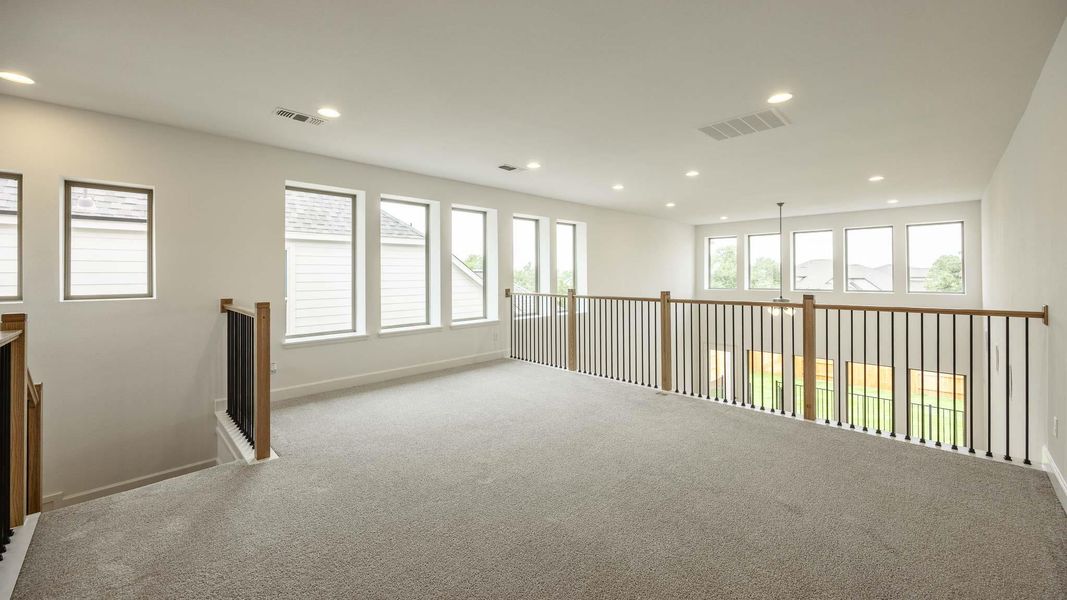 Spare room featuring carpet floors, recessed lighting, baseboards, and visible vents Spare room featuring carpet floors, recessed lighting, baseboards, and visible vents