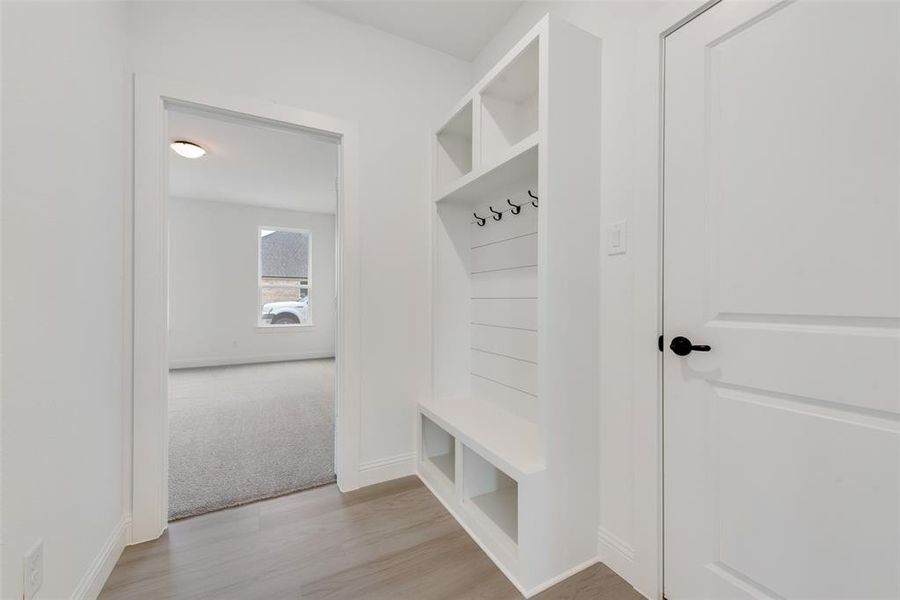 Mudroom featuring light wood-type flooring