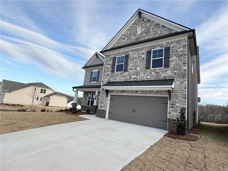 Front exterior of a new home in Ponderosa Farms Manor, Gainesville, GA, highlighting curb appeal (Image 27).
