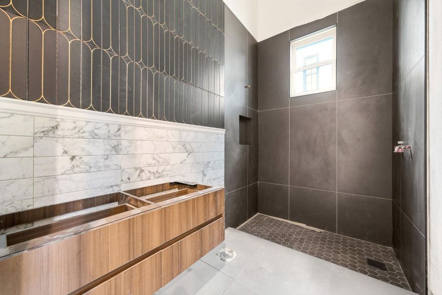 Example of unfinished Secondary Bathroom finishes with amazing tilework and beautiful color palette