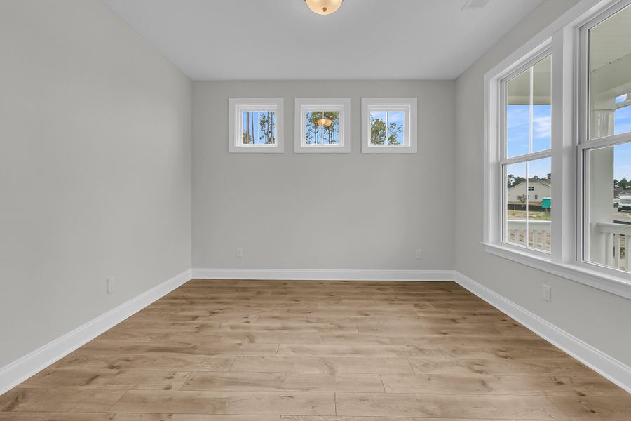 Spacious, unfurnished interior of a new home in Tidewater at Lakes of Cane Bay, Summerville (Image 14).