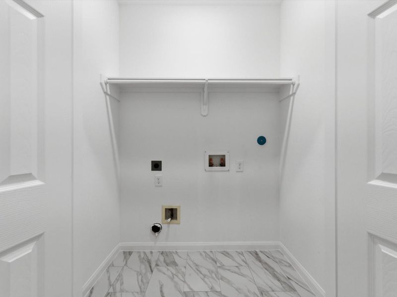 Designed with functionality in mind, the utility room provides a practical space to keep daily routines organized and out of sight. Designed with functionality in mind, the utility room provides a practical space to keep daily routines organized and out of sight.