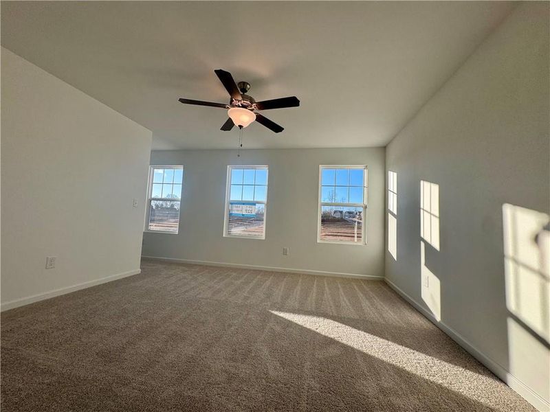 Spacious, unfurnished interior of a new home in Eastlyn Crossing, Flowery Branch (Image 11).