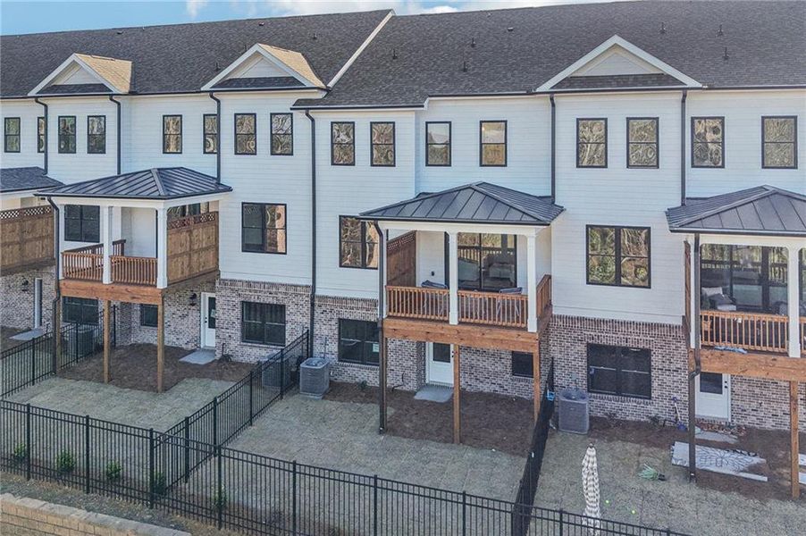 Front exterior of a new home in Millcroft Townhomes, Buford, GA, highlighting curb appeal (Image 2). Front exterior of a new home in Millcroft Townhomes, Buford, GA, highlighting curb appeal (Image 2).