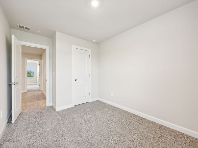 Two secondary bedrooms round out the upstairs.