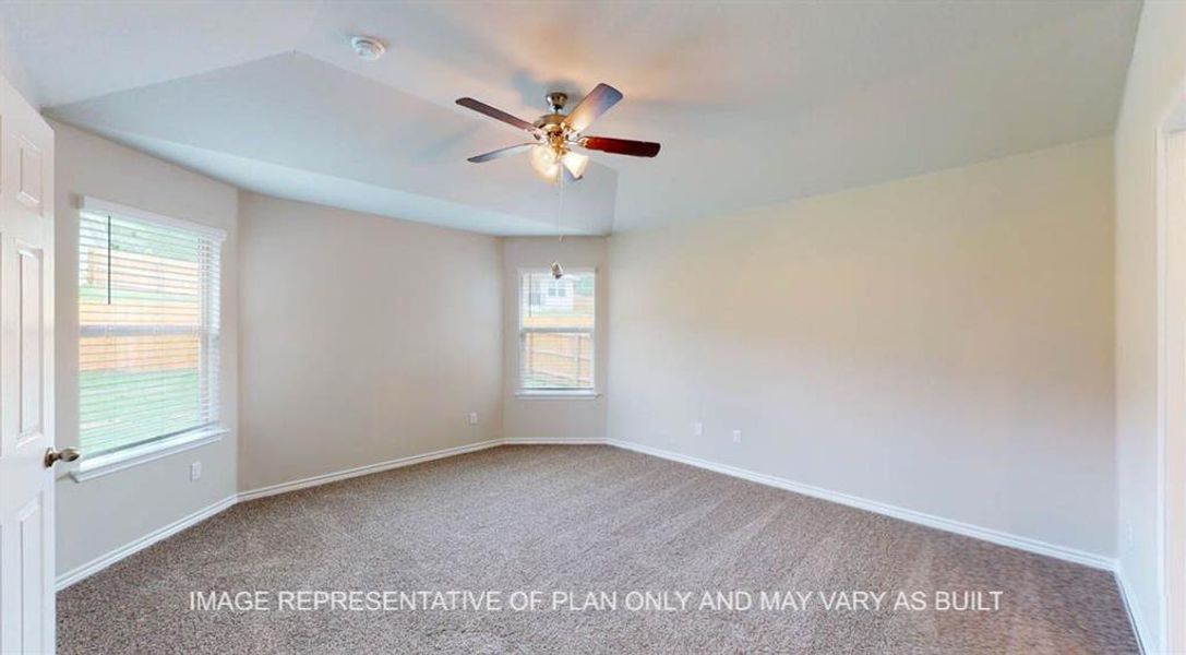 Empty room featuring carpet floors and a ceiling fan Empty room featuring carpet floors and a ceiling fan
