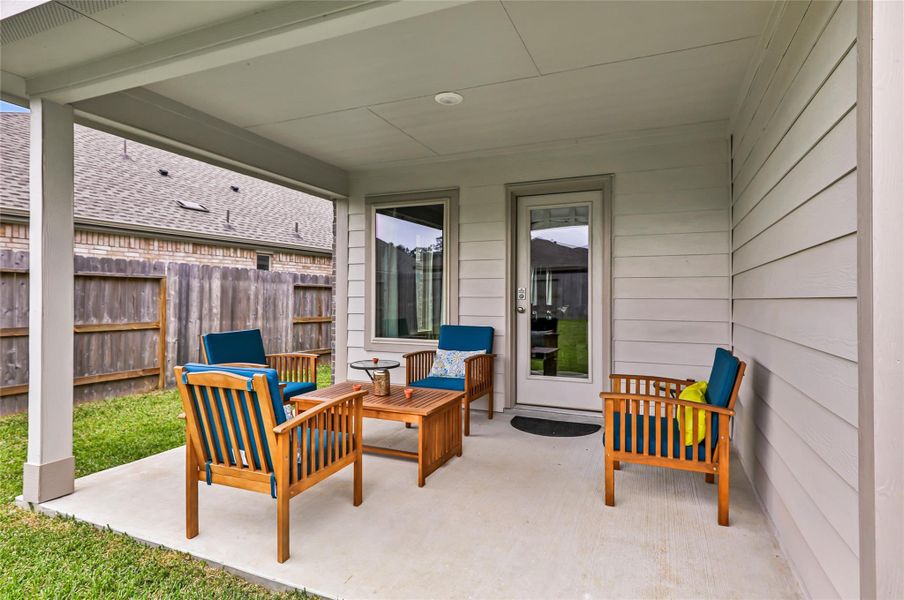 Exterior details and patio area of a home in Pinewood at Grand Texas, New Caney (Image 27).