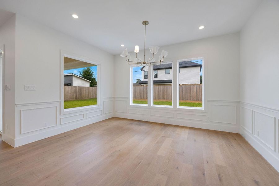 The dining room is defined, yet connected to the heart of the home and overlooks the expansive backyard. The dining room is defined, yet connected to the heart of the home and overlooks the expansive backyard.