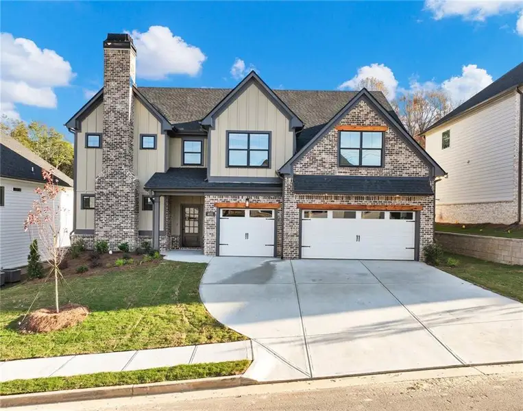 Front exterior of a new home in , Buford, GA, highlighting curb appeal (Image 1). Front exterior of a new home in , Buford, GA, highlighting curb appeal (Image 1).