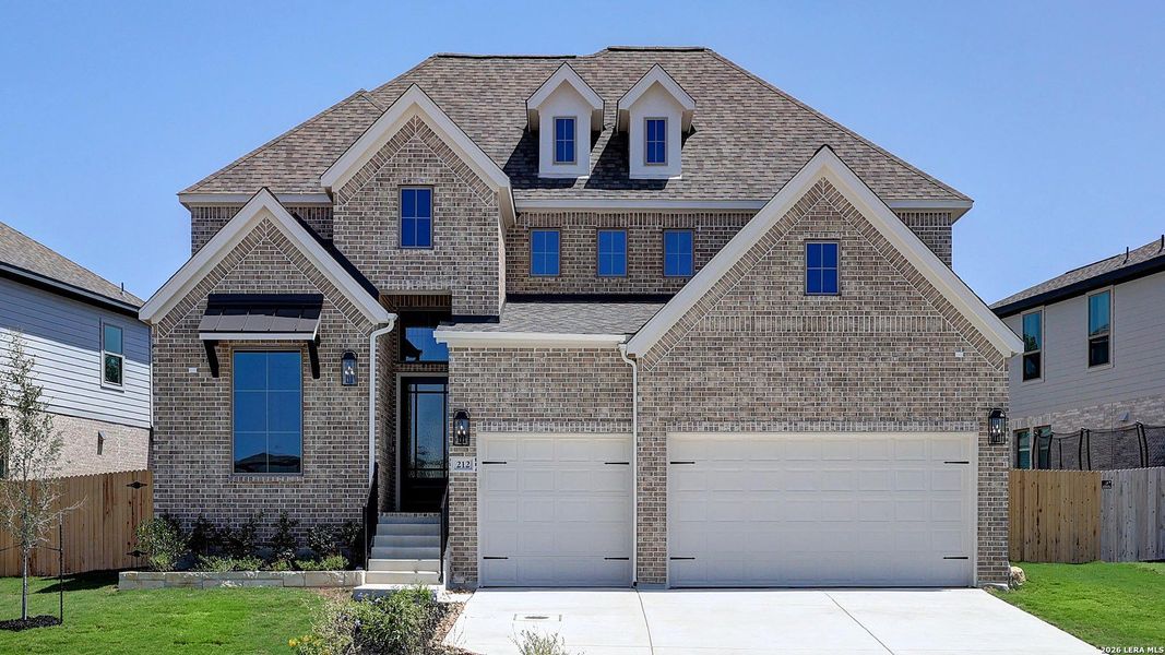 Front exterior of a new home in The Ranches at Creekside, Boerne, TX, highlighting curb appeal (Image 23). Front exterior of a new home in The Ranches at Creekside, Boerne, TX, highlighting curb appeal (Image 23).