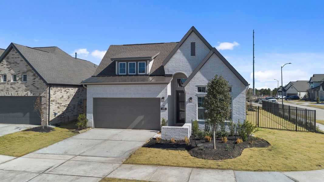 Front exterior of a new home in Bridgeland, Cypress, TX, highlighting curb appeal (Image 2). Front exterior of a new home in Bridgeland, Cypress, TX, highlighting curb appeal (Image 2).