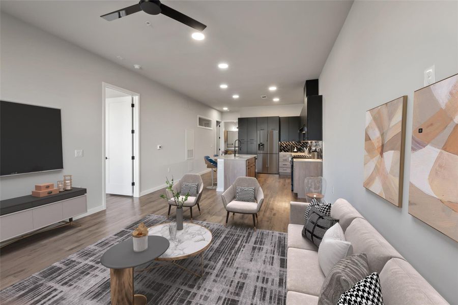 Living area with light wood-style flooring, a ceiling fan, recessed lighting, and baseboards