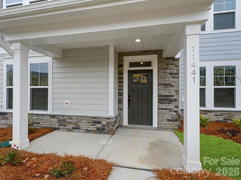 Exterior details and patio area of a home in North Creek Village, Huntersville (Image 3).