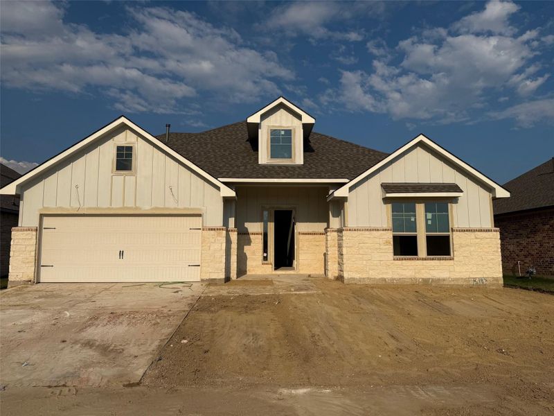 Front exterior of a new home in Wellborn Settlement, College Station, TX, highlighting curb appeal (Image 1).