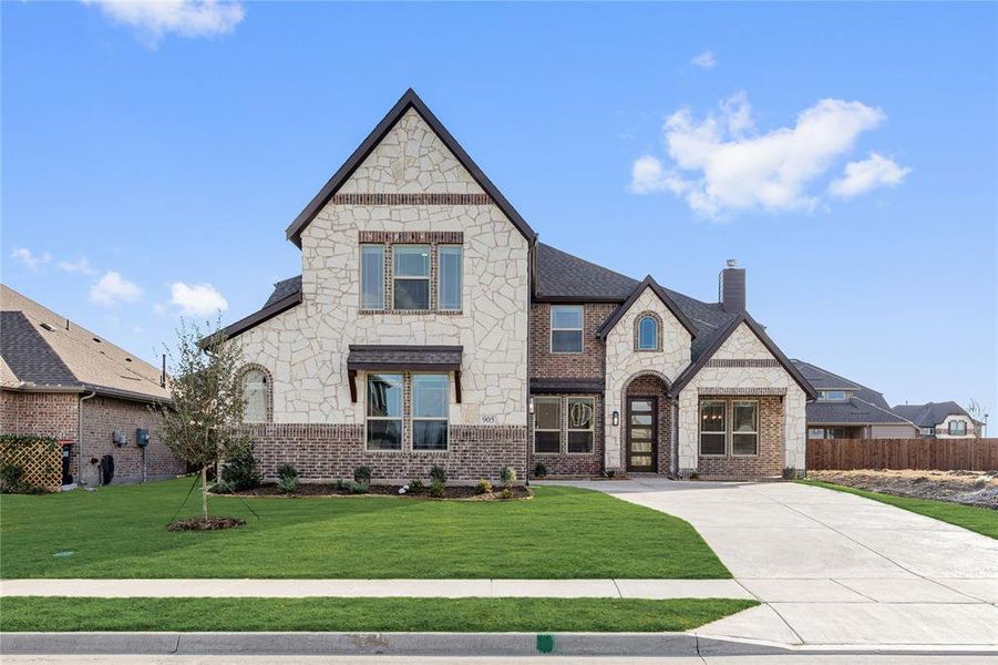 Front exterior of a new home in West Crossing, Anna, TX, highlighting curb appeal (Image 26). Front exterior of a new home in West Crossing, Anna, TX, highlighting curb appeal (Image 26).