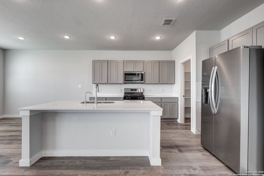 Furnished interior view inside a new home in Hacienda, San Antonio (Image 10).