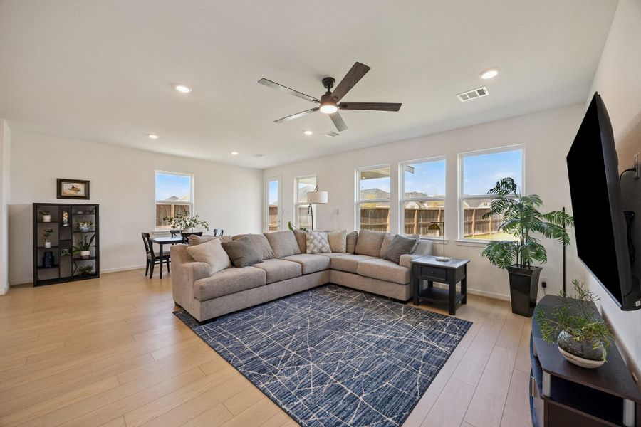 Spacious Den open to the Kitchen with large windows to enjoy your lush, green back yard.