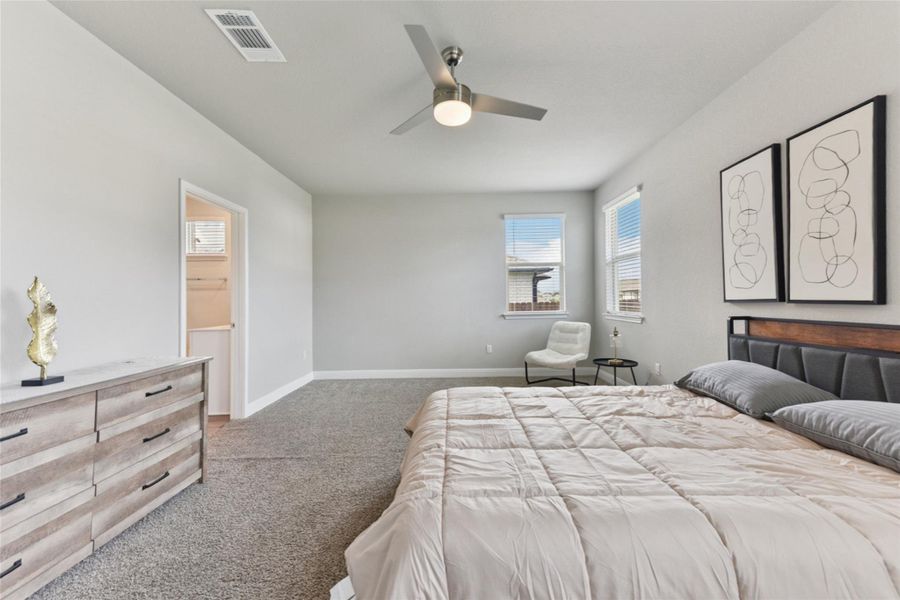 Bedroom with carpet floors and ceiling fan Bedroom with carpet floors and ceiling fan