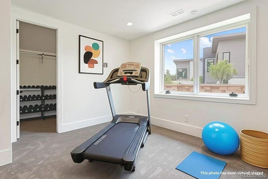 Lower level bedroom/gym. *This photo has been virtually staged.