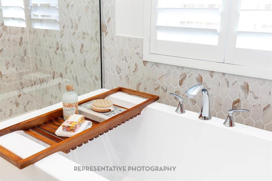 Bathroom view of tasteful backsplash and tile walls