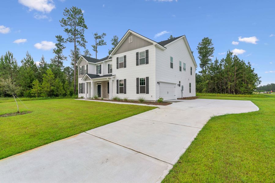 Front exterior of a new home in NorthShore on the St. Marys River, Kingsland, GA, highlighting curb appeal (Image 2). Front exterior of a new home in NorthShore on the St. Marys River, Kingsland, GA, highlighting curb appeal (Image 2).