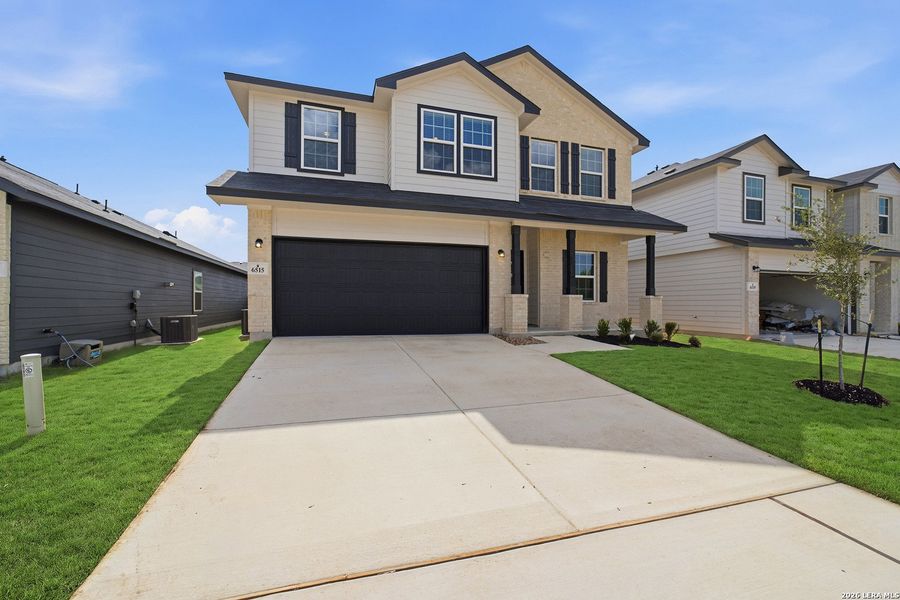Front exterior of a new home in Morgan Meadows, San Antonio, TX, highlighting curb appeal (Image 1). Front exterior of a new home in Morgan Meadows, San Antonio, TX, highlighting curb appeal (Image 1).