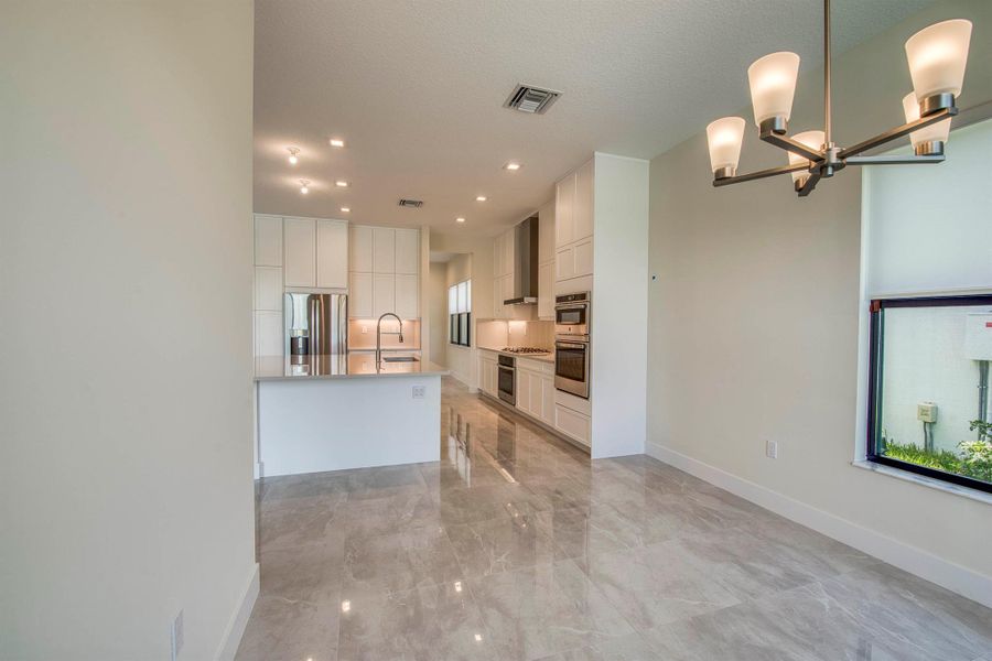 Furnished interior view inside a new home in Apex at Avenir, Palm Beach Gardens (Image 16).