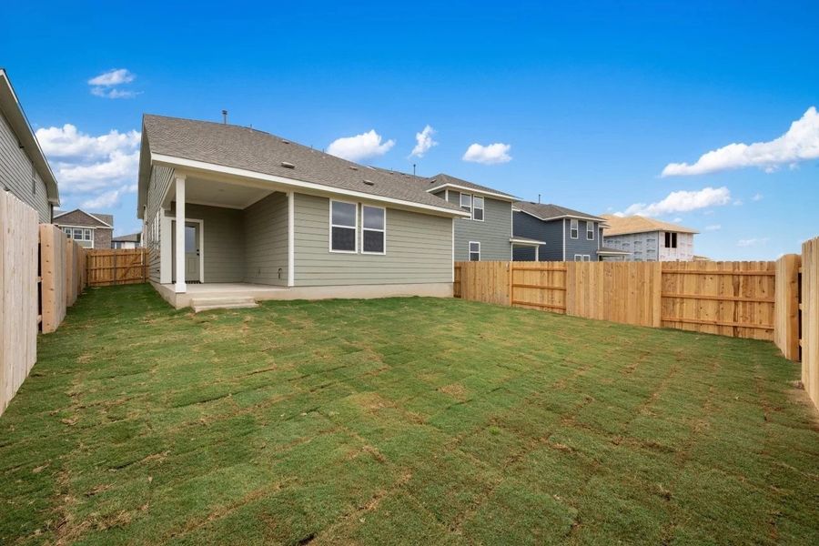 Exterior details and patio area of a home in Lariat, Liberty Hill (Image 17).