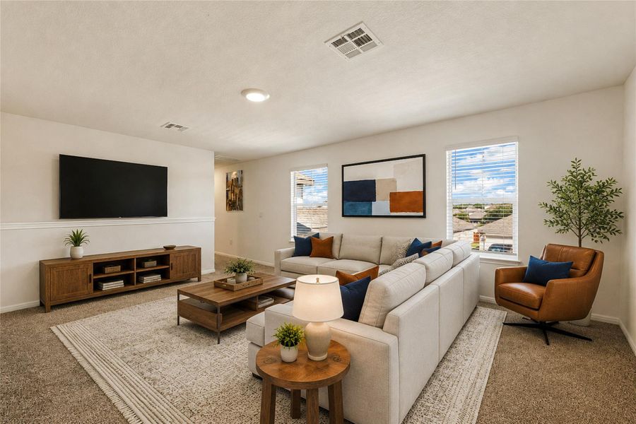 Virtually staged - Upper family living area, perfect for gathering, features carpeted floors and generous natural light from broad windows.