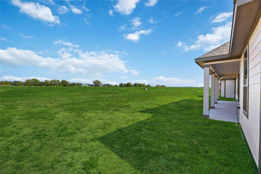 Front exterior of a new home in Blue Heron Estates, Beasley, TX, highlighting curb appeal (Image 15).