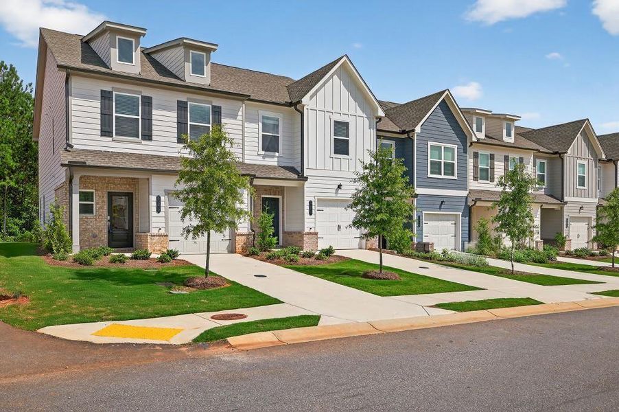 Front exterior of a new home in Fernhurst, McDonough, GA, highlighting curb appeal (Image 2). Front exterior of a new home in Fernhurst, McDonough, GA, highlighting curb appeal (Image 2).