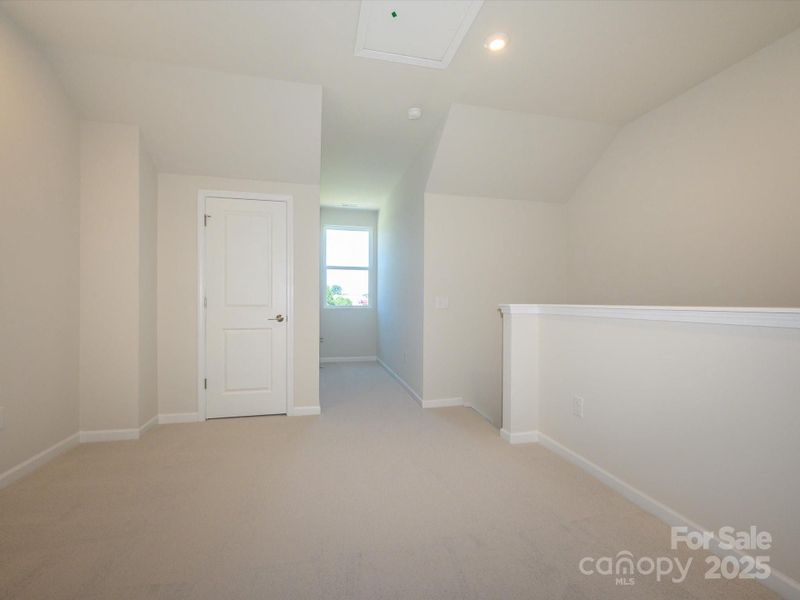 Fourth floor loft ideal for a home office, gym, or movie room.