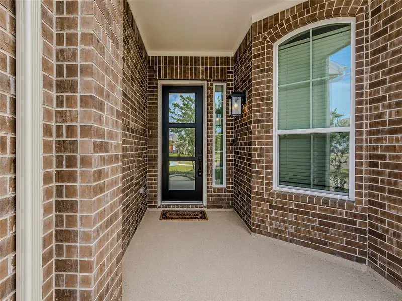 Exterior details and patio area of a home in , Katy (Image 3).