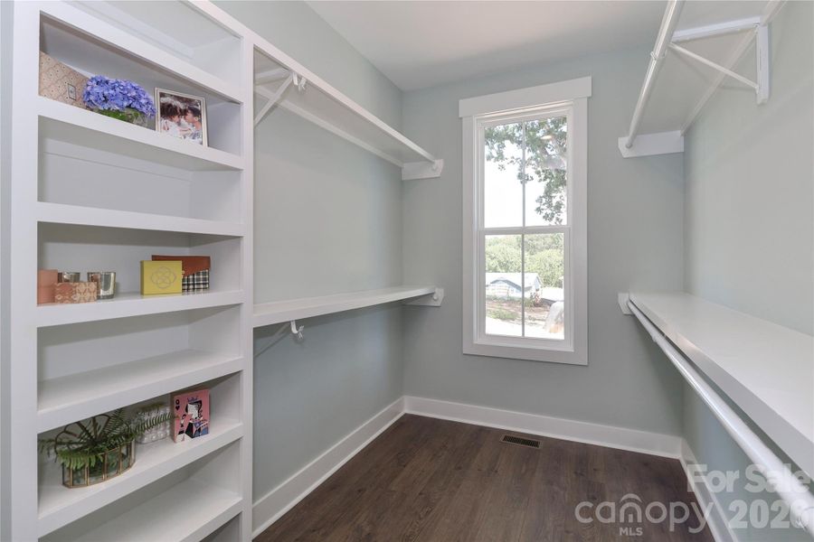 With an oversized walk-in primary closet, organization and storage spaces are abundant. With an oversized walk-in primary closet, organization and storage spaces are abundant.