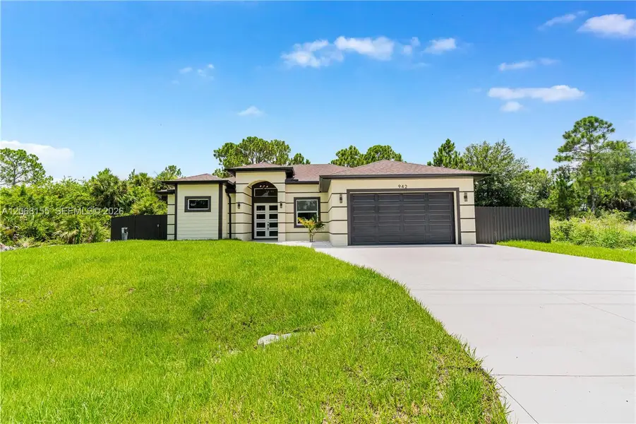 Front exterior of a new home in , Lehigh Acres, FL, highlighting curb appeal (Image 2). Front exterior of a new home in , Lehigh Acres, FL, highlighting curb appeal (Image 2).