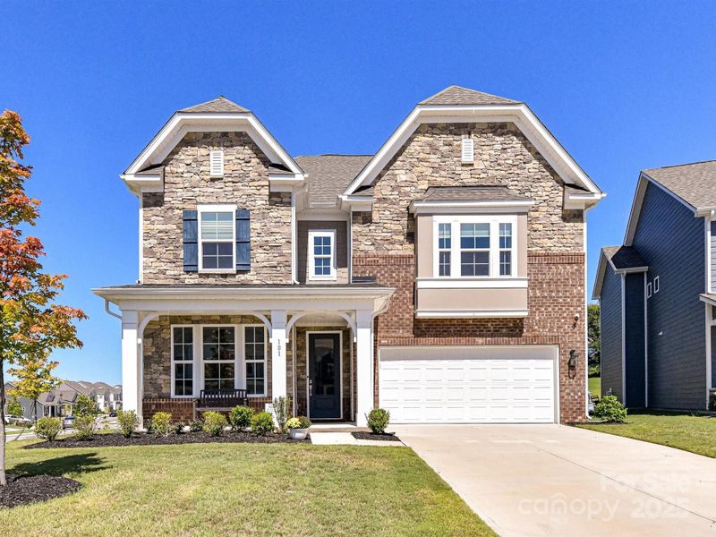 Immaculately Maintained, 4 Bedroom, 3.5 Bath Home with covered front porch, 2 car garage & fenced back yard located in lake access community, Reids Cove!