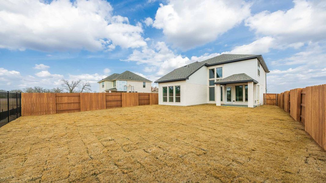 Exterior details and patio area of a home in The Colony, Bastrop (Image 2).