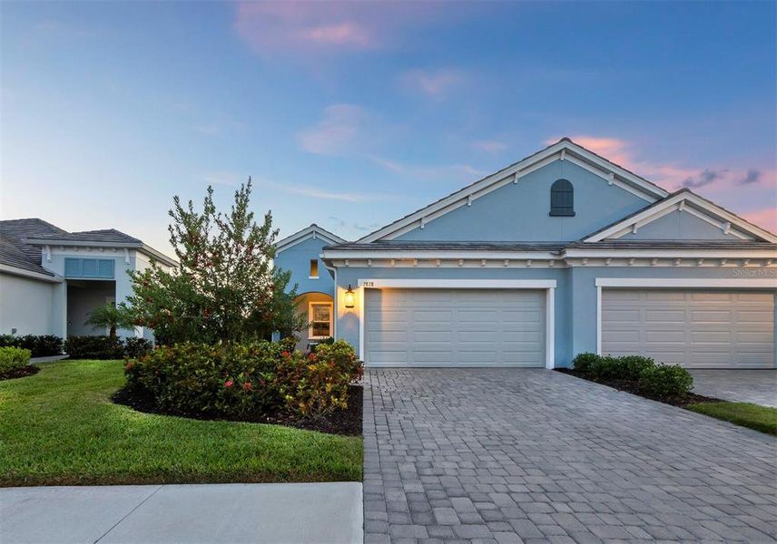 Front exterior of a new home in , Sarasota, FL, highlighting curb appeal (Image 2).