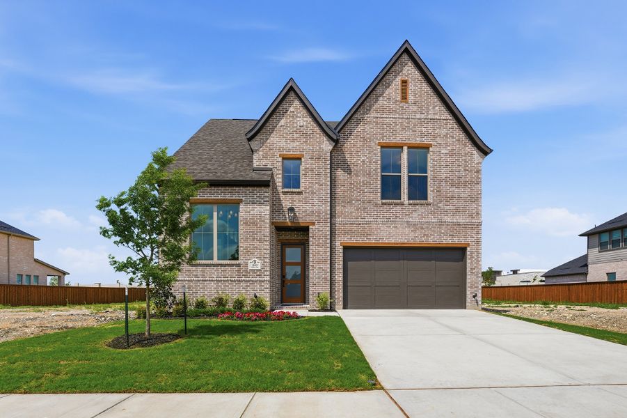Front exterior of a new home in Hillside Village, Celina, TX, highlighting curb appeal (Image 1). Front exterior of a new home in Hillside Village, Celina, TX, highlighting curb appeal (Image 1).