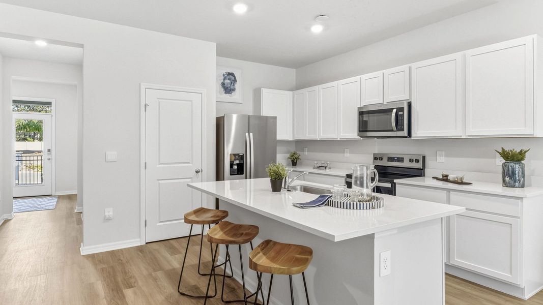 Furnished interior view inside a new home in The Gardens at Bay Street, Sarasota (Image 9).