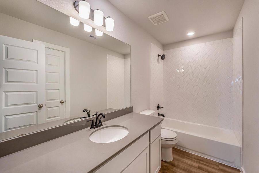 Furnished interior view inside a new home in Deer Pines, Conroe (Image 11).