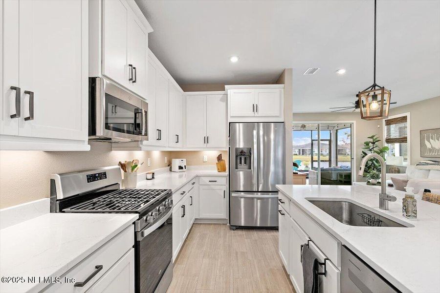 Furnished interior view inside a new home in RiverTown - WaterSong, St. Johns (Image 8).
