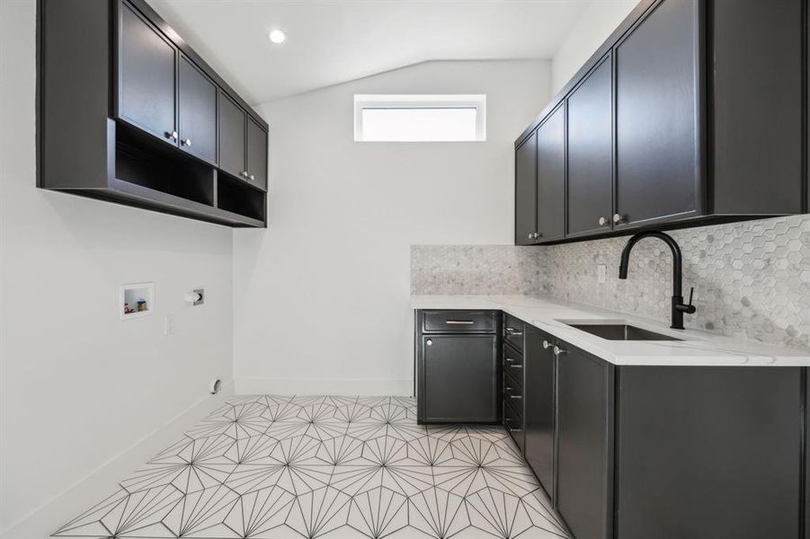 Spacious upstairs second laundry room with storage, sink and bonus room. Spacious upstairs second laundry room with storage, sink and bonus room.
