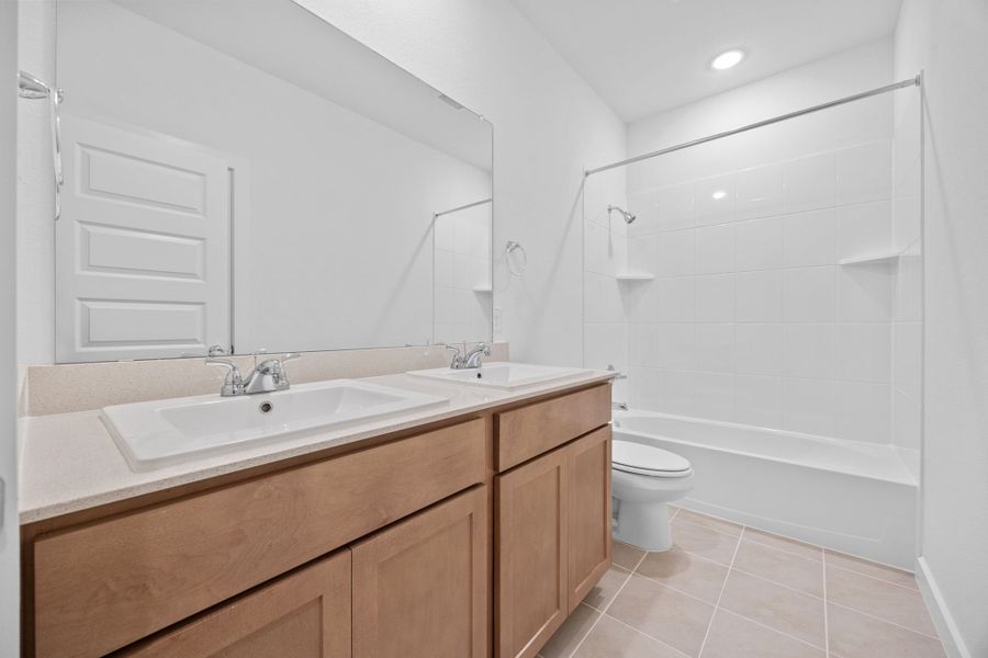 Bathroom in the Quartz home plan by Trophy Signature Homes – REPRESENTATIVE PHOTO