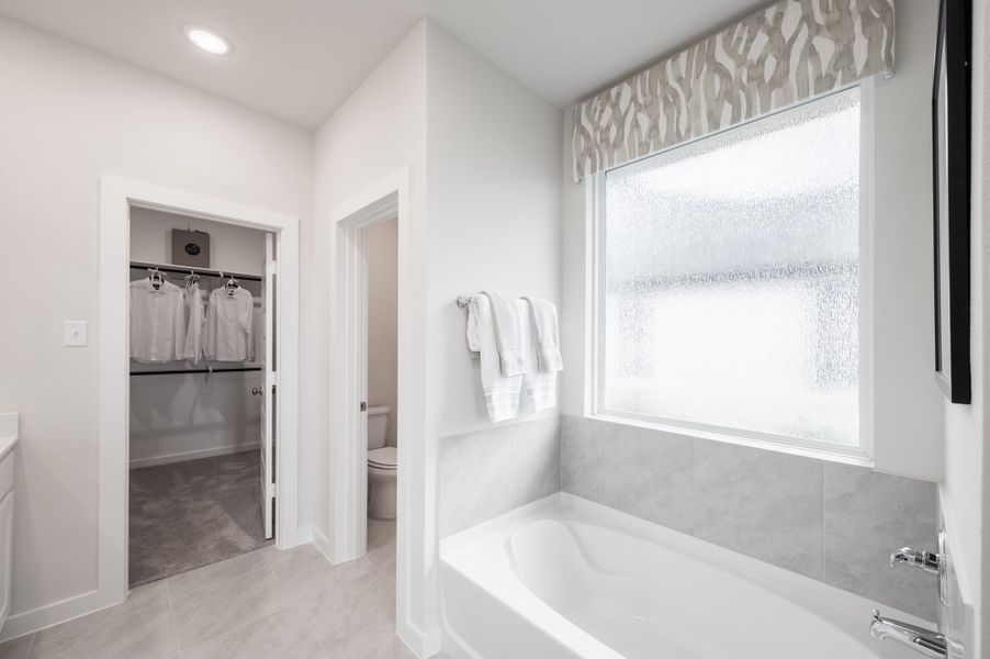 Representative furnished interior of a home built from the Caddo by Tri Pointe Homes in Mason Woods, Cypress (Image 7).